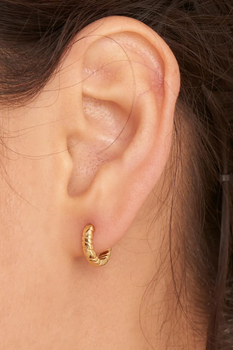 Smooth Operators Gold Twisted EOL Huggie Earrings